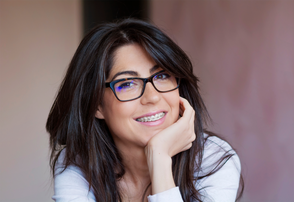 adult woman with braces smiling