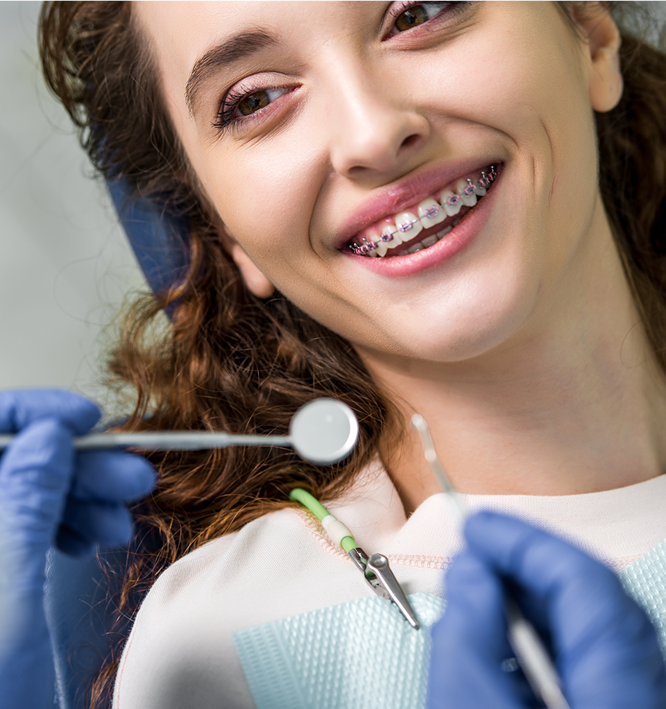 Woman with braces smiling. Central PA Orthodontist